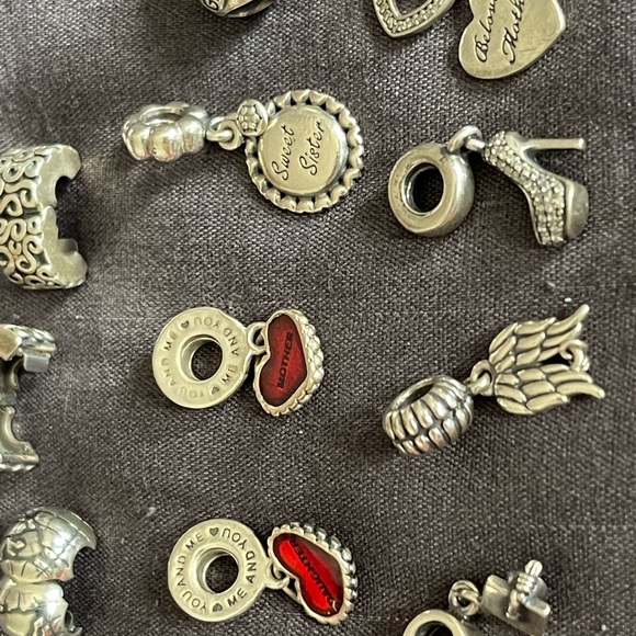 Lot of 26 Authentic Pandora charms.